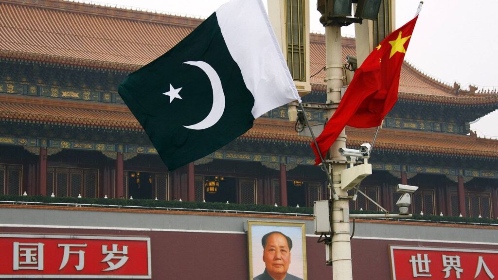 A Pakistani national flag flies alongside a Chinese national flag in front of the portrait of Chairman Mao Zedong in Beijing's Tiananmen Square. REUTERS/David Gray